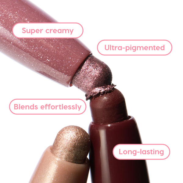 Rose Goals ColourPop Shadow Stix twist-up eyeshadow tips touch in a close-up, showcasing creamy, ultra-pigmented rose and mauve shimmer that blends effortlessly and lasts long, with a champagne shade below and deep berry casing in studio light.