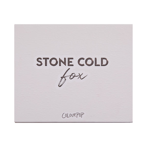 Stone Cold Fox shadow palette shown closed, featuring embossed βSTONE COLD foxβ lettering on a pale taupe faux-leather cover with ColourPop logo, studio-lit on a white background; a sleek neutral ColourPop Shadow Palette packaging shot.