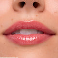 Lips coated in Keepin’ It Sweet Ultra Glossy Lip (ColourPop Ultra Glossy Lip) gleam with a sheer pink, glassy finish in a tight close-up, highlighting smooth texture and shine around the mouth.