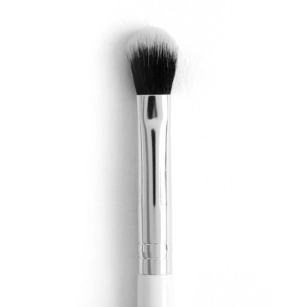 ColourPop Blending Brush makeup brush blending and diffusing eyeshadow; soft domed duo-fiber black-to-white synthetic bristles with a polished chrome ferrule and white handle, shown close-up on a white background.