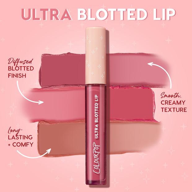 ColourPop Ultra Blotted Lip Zuma stands upright, displaying mauve and nude swatches that show a diffused blotted finish and smooth, creamy texture, highlighting a long-lasting, comfy formula against a pink, starry backdrop.