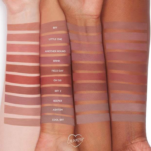 Ashton ColourPop Lippie Pencil swatched on three forearms, a mid‑tone nude brown stripe labeled “ASHTON” among other shades, showing smooth matte payoff and how the lip liner appears on light, medium, and deep skin tones.