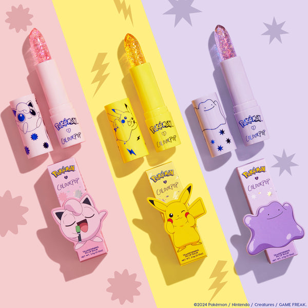 ColourPop pH Lip Balm Transform shown opened in a flatlay, glittery balm bullets in pink, yellow, and lavender tubes with Pokémon Jigglypuff, Pikachu, and Ditto art, set on pastel panels beside the matching boxes.