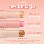 Glazey Lite Stix highlighter - champagne-gold ColourPop Lite Stix - twist-up bullet extended, displayed alongside blush and bronze sticks on a peach gradient backdrop with “swipe & go” messaging for a quick, blendable glow.