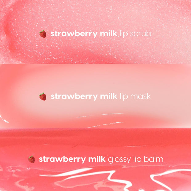 Strawberry Feels ColourPop Lip Care Kit displaying three pink swatches - strawberry milk lip scrub, lip mask, and glossy lip balm - each labeled with a tiny strawberry icon, showing shimmering scrub, creamy mask, and high-shine balm textures.