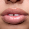 Close-up swatches of Colourpop Peach Mochi Fresh Kiss Glossy Balm on models’ lips, showing sheer peachy shimmer and high-shine finish, highlighting how this Lip Gloss & Lip Oil hybrid looks on different skin tones.