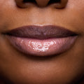 Close-up of models’ lips wearing Colourpop Fresh Kiss Glossy Balm in Raspberry Crème, showing sheer pink shimmer Lip Gloss & Lip Oil finish on different skin tones against a simple studio background.