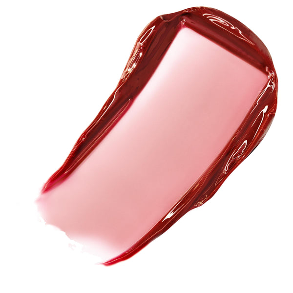 Sheer berry-pink swatch of ColourPop Fresh Kiss Glossy Balm in Wild Berry, gliding in a thick, high-shine stripe with jelly-like edges on a white background, showcasing its translucent tint and glossy, hydrating finish.