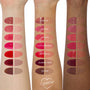 Baby Fox ColourPop Lip Stain swatch - glossy and stain finishes shown as paired ovals on three arms (light, medium, deep), top row labeled Baby Fox, revealing a warm rosy‑brown tone with high shine and sheer stain, alongside other shade comparisons.