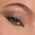 Hazel eye wears shimmering taupe and espresso shadows, showcasing the Deja Brew ColourPop Shadow Palette with a metallic lid, soft matte crease, smoky outer corner, and precise black winged liner, captured in a studio close-up.