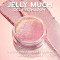 ColourPop Jelly Much Shadow Hallucinogenius swirled in a clear jar, catching light to reveal a pink-to-gold duochrome metallic sheen, with vibrant pigment swatches on a soft pink backdrop, showcasing its jelly gel eyeshadow texture.