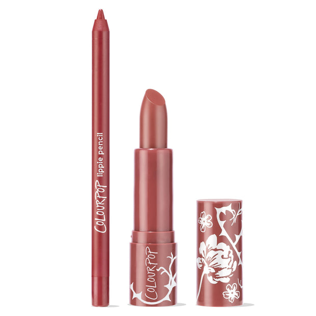Anti-Hero ColourPop Lux Lipstick standing uncapped beside a matching lippie pencil, both in a rosy mauve tone; the lipstick’s floral-printed tube and cap rest on a clean white background, highlighting the bullet and precise liner for a coordinated lip look.