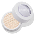 Ladybird Super Shock Shadow by ColourPop sits with its clear lid tipped open, revealing a glittery champagne‑beige pan with bouncy, dimpled texture in a white round pot on a clean studio background.