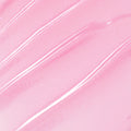 You're a Catch ColourPop Lip Mask swatch gliding in diagonal streaks, showing a sheer baby pink, glossy, micro-shimmer finish in a close-up texture shot.