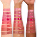 ColourPop Baby Bunny Lip and Cheek Balm swatch, a glossy warm pink, shown on three arms across light, medium, and deep skin tones alongside labeled shades for comparison, highlighting creamy dewy finish and buildable color.