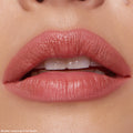 Full lips outlined and lightly filled with ColourPop Lippie Pencil Pinky Promise, a creamy rose-pink lip liner, in a tight close-up showing smooth definition and a soft semi-matte finish.