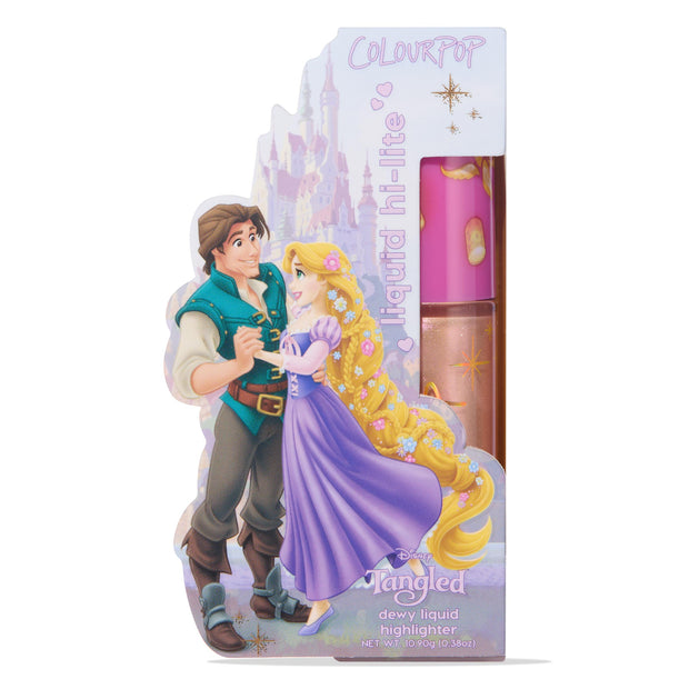 ColourPop Liquid Highlighter I See the Light tube displayed upright in Disney Tangled Rapunzel packaging with Flynn Rider, featuring a pink lantern-print cap and a clear bottle showing a sparkly champagne-gold dewy formula for a radiant glow.