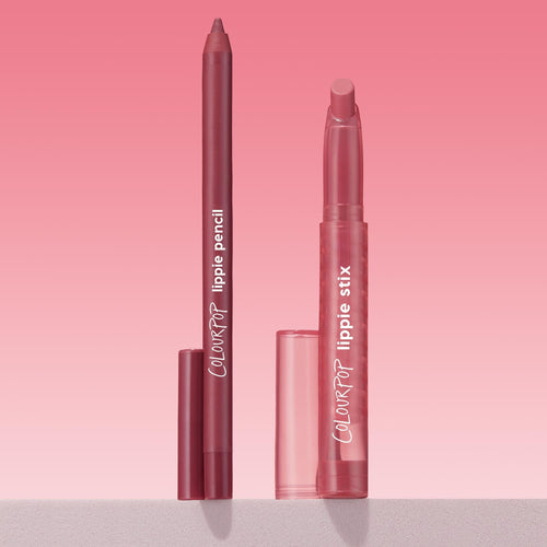 ColourPop Got Pink? Lippie Stix + Pencil Set showing a rosy mauve lip pencil and matching Lippie Stix standing uncapped with translucent pink caps beside them on a light shelf against a pink gradient background; ColourPop Lippie Stix + Pencil Set.