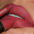 ColourPop Lippie Pencil Shot Clock lines and defines full lips in a creamy matte mauve‑pink, paired with a matching star‑embossed Lux Lipstick bullet in a tight studio close‑up beauty shot.