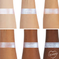 ColourPop Moon Daisy Super Shock Shadow swatches showing a high-shine icy lavender-blue shift across six arms from light to deep skin tones, demonstrating smooth metallic payoff and sparkle; ColourPop heart logo in the bottom right.