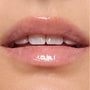 Glossy, translucent pink lips catching light in a tight studio close-up, wearing hydrating lip oil from the Shrek‑Spress Yourself ColourPop Lip and Eye Set, emphasizing smooth shine and soft natural color for everyday makeup.