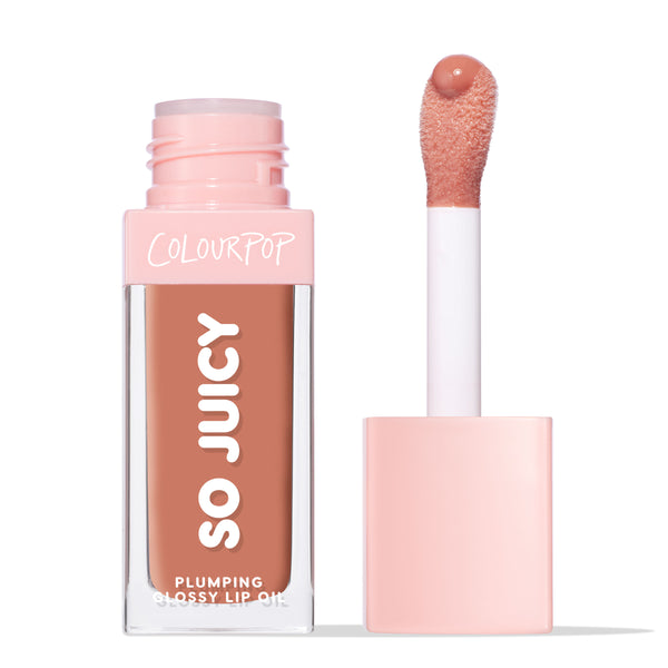 ColourPop So Juicy Plumping Glossy Lip Oil in It’s a Date shown with the pink cap off, a doe‑foot applicator holding peachy nude gloss beside the clear rectangular tube on a clean white background.