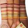 Sweet as Hunny ColourPop Eye & Lip Set swatches run in rows across three light, medium, and deep arms, showing matte and shimmer shades from brick red and honey gold to olive green with shade names labeled, palette visible at bottom right.