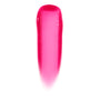 Glossy lip swatch shows the sheer hot pink, high-shine jelly finish of the ColourPop Ultra Glossy Lip in Surfer Vibes, displayed as a smooth vertical swipe on a white background.