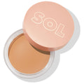 Fair shade of ColourPop SOL Face & Body Bronzing Balm shown open in a clear round jar with a peach lid embossed with SOL Body, smooth light tan cream surface, studio shot on a white background with a soft shadow.