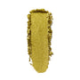 Shimmery lime-green eyeshadow swatch spreads vertically with textured edges on a white background, showcasing ColourPop Super Shock Shadow in Green Juice, a metallic, glittery finish for bold, high-shine eye looks.