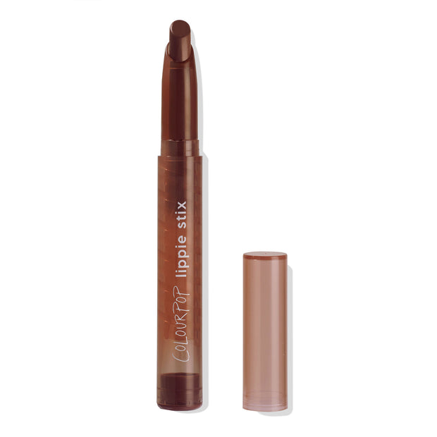 ColourPop Lippie Stix in shade Pitch opened to reveal a deep chocolate brown bullet, slim translucent brown tube with vertical lippie stix branding, cap set beside, on a clean white studio background.
