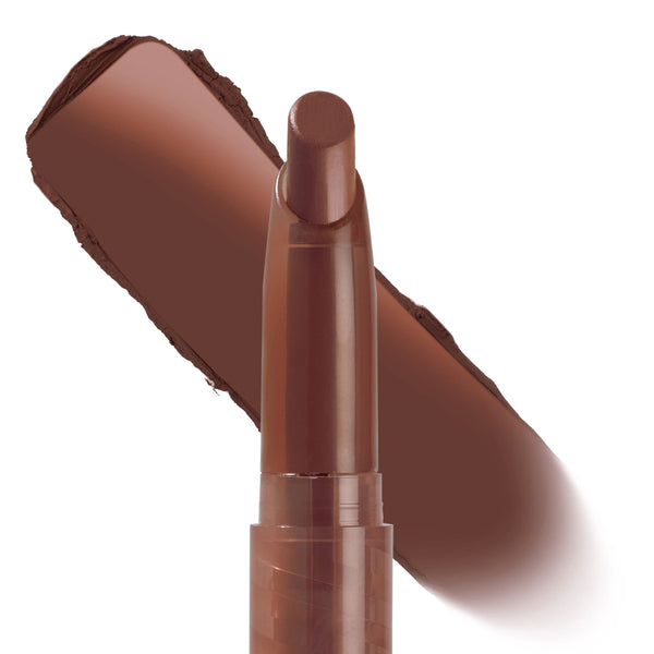 Hot in Here ColourPop Lippie Stix stands uncapped in a slim twist-up tube, tip angled forward, with a wide swatch of warm chocolate-brown color behind it on a white background, highlighting the creamy lipstick shade.