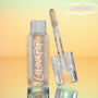 ColourPop Chrome Liquid Shadow in Sweetzer Ave stands open as the doe-foot applicator reveals a multi-chrome gold-peach sheen, the clear tube with white ColourPop logo reflecting against a mint-to-peach gradient background with a “MUST-HAVE” badge.
